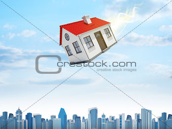 House is falling from the sky. City on background