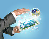Man hands using tablet pc. Business city on touch screen. Earth near computer
