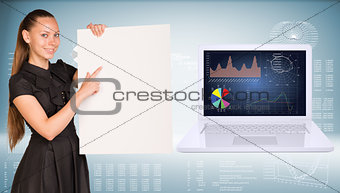 Businesswoman holding empty paper. Laptop and graphs