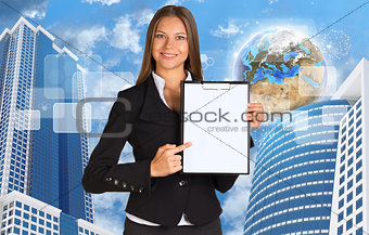 Businesswoman holding paper holde. Building and Earth