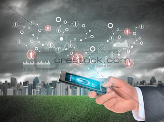 Man hand using smartphone. Earth on phone screen. City as backdrop