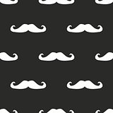 Seamless vector pattern, tile background or texture with white mustaches on black background.