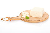 Delicious tofu isolated on cutting board.