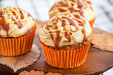 Carrot cupcakes with caramel cream cheese topping