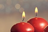 red christmas candles on bokeh background