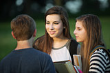 Three Students Talking Outdoors