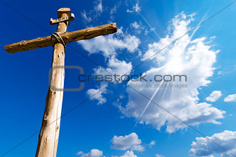 Wooden Cross Against a Blue Sky