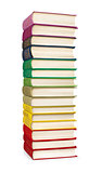 stack of colorful vintage books on white isolation