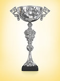 champion silver trophy isolated on yellow
