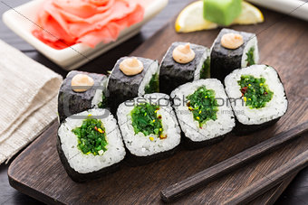 Sushi rolls with chuka salad