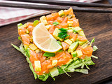 Salad with salmon, avocado and lettuce