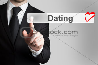 businessman pushing flat touchscreen button dating heart symbol