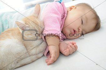 Baby and cat sleeping together