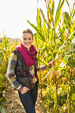 Portrait of smiling young woman in cornfield