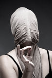  Woman Covering Face with Cloth, Making Hand Sign 