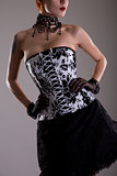 Attractive young woman in black and white corset 