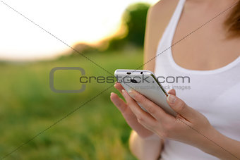 Woman Using Mobile Smart Phone Outdoors