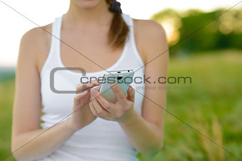 Woman Using Mobile Smart Phone Outdoors