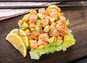 Salad with salmon, avocado and lettuce