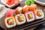 Rainbow sushi roll with salmon, tuna and eel