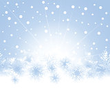 Christmas snowflakes on blue background of the greeting card.