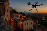 Flying drone in the sunset skies
