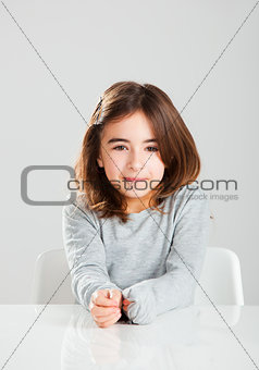 Little girl in a desk