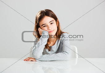 Little girl in a desk