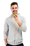 Man tasting a green fresh apple