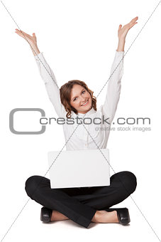 Portrait of a pretty young woman sitting in front of her laptop