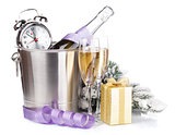 Christmas champagne with alarm clock in bucket and gift box