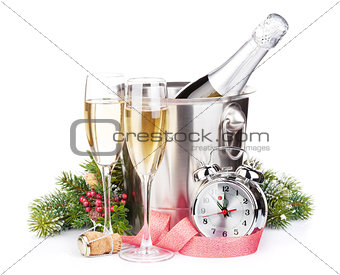 Christmas champagne with alarm clock and fir tree
