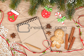 Christmas fir tree, decor, gingerbrean man and blank notepad