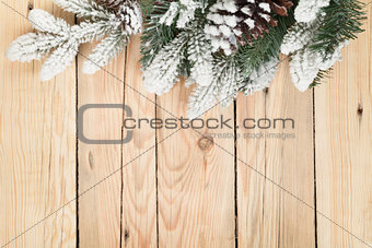 Christmas fir tree on wooden board background