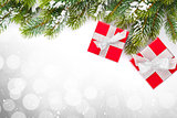 Christmas gift boxes and snow fir tree