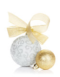 Christmas baubles and golden ribbon