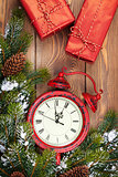 Christmas clock, gift boxes and snow fir tree
