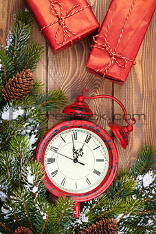 Christmas clock, gift boxes and snow fir tree