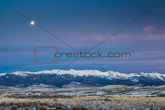 full moon over mountains