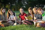 Teens Doing Homework Outdoors