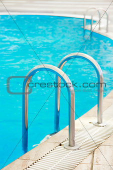 steps in a blue water pool