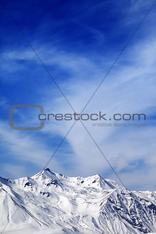 Winter snowy mountains at windy day
