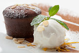 Warm chocolate cake Fondant with ice-cream ball, almond, mint, c