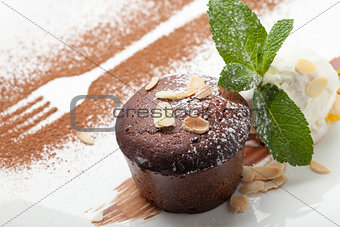 Warm chocolate cake Fondant with ice-cream ball, almond, mint, c