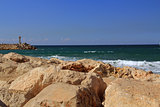 Sea Wall with Small lighthouse on the Mediterranean Sea in Herzliya Israel