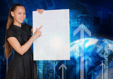 Beautiful businesswoman in dress holding empty paper sheet. Earth, arrows and buildings on background