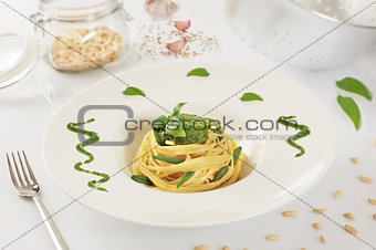 pasta spaghetti with pesto with white background