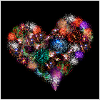 a group of exploding fireworks shaped like a heart.
