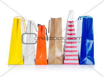 Bright gift bags isolated on white background