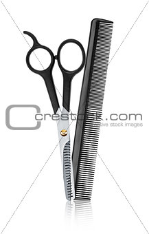 scissors and comb professional hairdresser with reflection